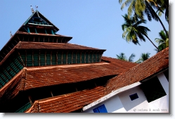 mishkal_mosque_kozhikode_01 * Mishkal Mosque at Kuttichira, Kozhikode, built by Nakhuda Mishkal in the 14th century. Nakhuda Mishkal was a renowned trader and ship owner from Yemen. As you can see, the mosque was designed in the traditional kerala architecture of that period.

The Mishkal Mosque at Kuttichira stands as a symbol of communal harmony. In 1510 AD, the Portuguese had attacked the mosque and partially destroyed it. Supposdely, their mission was to divide and rule, breaking the harmony between hindus and muslims. The Samoothiri (Zamorin), the local ruler at that time, didn't fall for this and helped in defending and repairing the mosque.  

The mosque was 5 storeyed, but after the destruction, it remained as a 4 storeyed structure. The walls of the mosque, except the ground floor are made of wood. Remnants of the portuguese destruction can still be seen on the upmost floor.